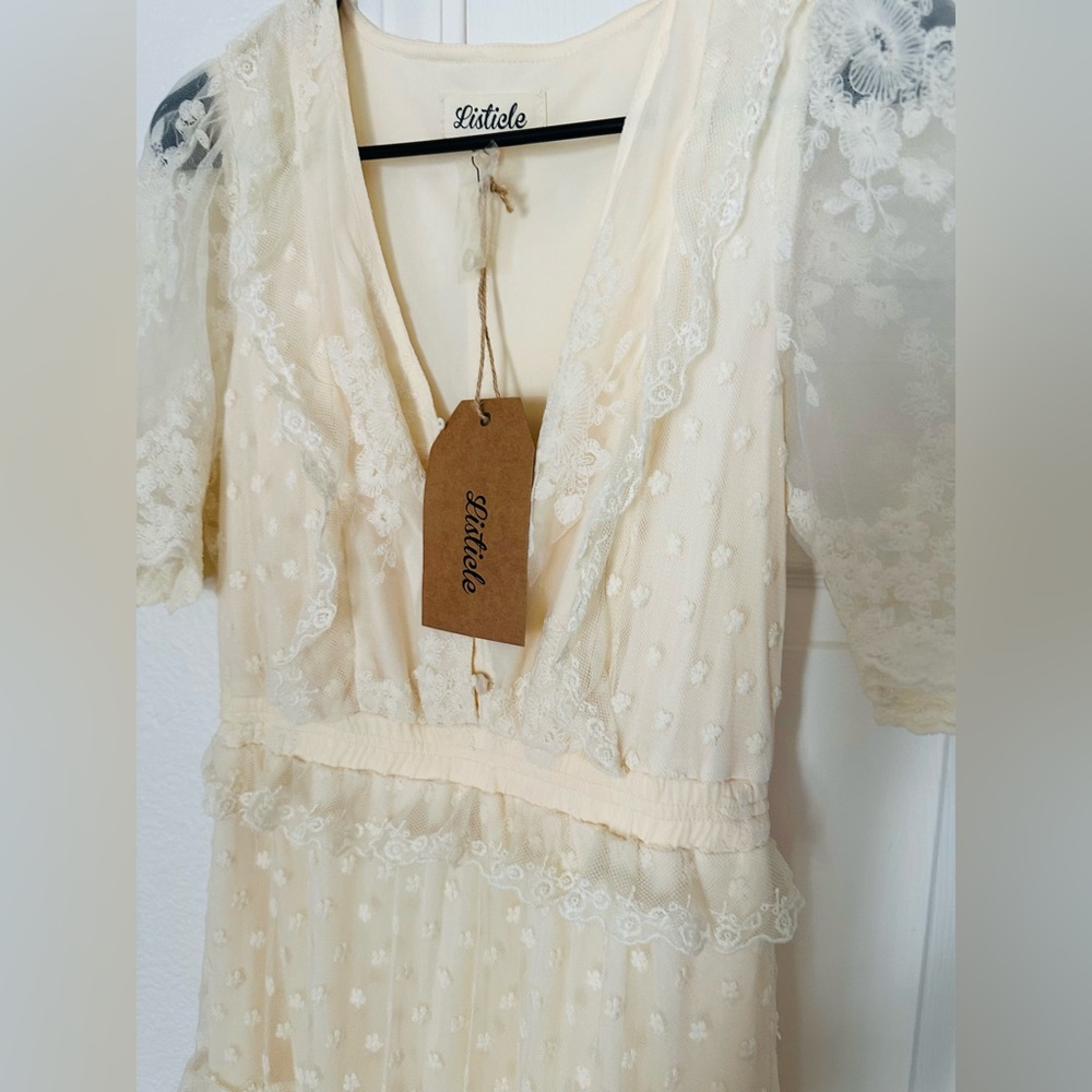 Brand Lysticle, Color Blue. Other is Ivory. Size Small